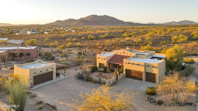 birds eye view of property featuring a mountain view