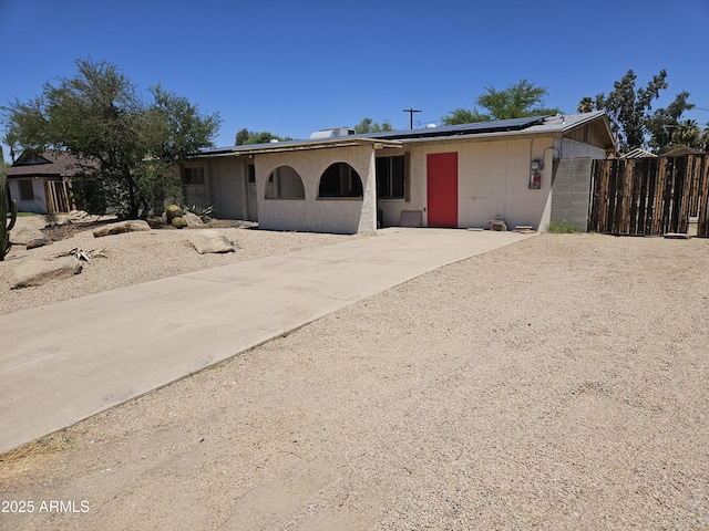 4110 E Wagoner Rd, Phoenix, AZ 85032 - single story home with roof mounted solar panels and concrete driveway