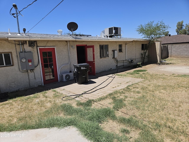 4110 E Wagoner Rd, Phoenix, AZ 85032 - back of house featuring a yard, stucco siding, and a patio