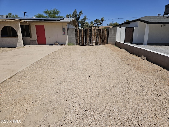 4110 E Wagoner Rd, Phoenix, AZ 85032 - view of side of home featuring solar panels and driveway