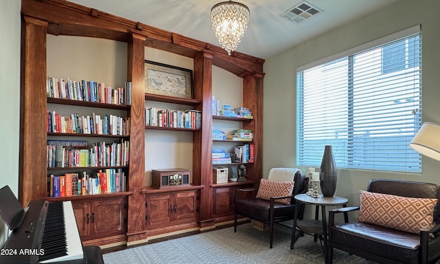 living area with a chandelier