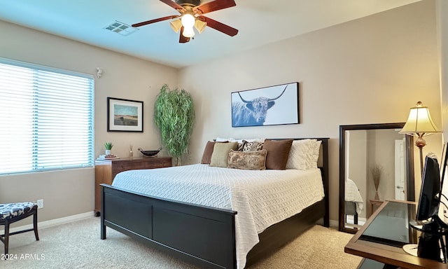 bedroom featuring ceiling fan and light carpet