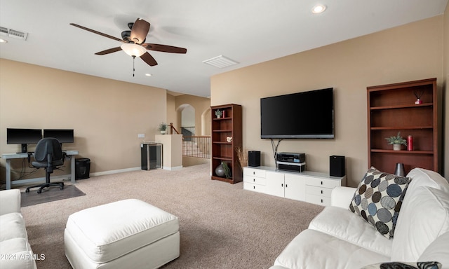 living room with light carpet and ceiling fan