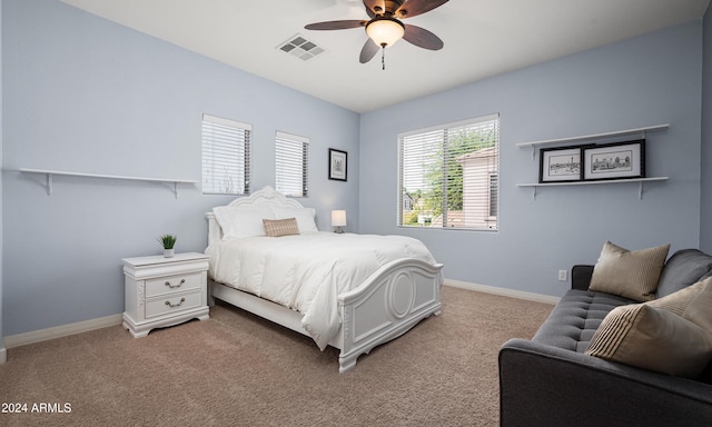 bedroom with light carpet and ceiling fan