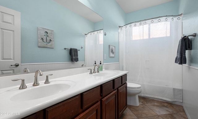 full bathroom featuring vanity, shower / bath combination with curtain, and toilet