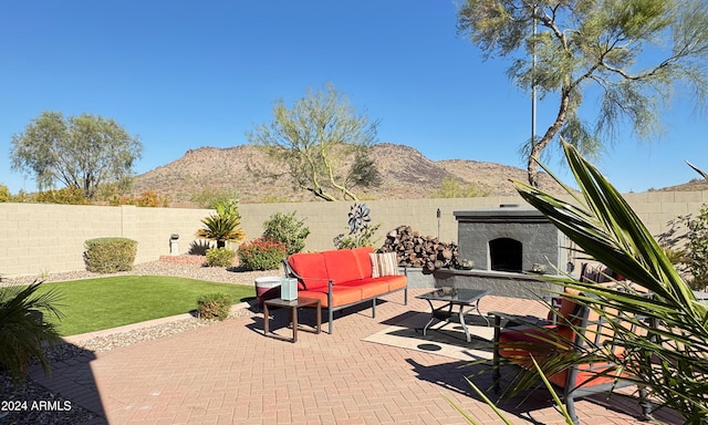 view of patio featuring a mountain view and an outdoor hangout area