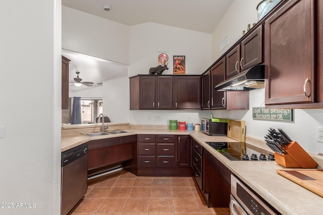 kitchen with stainless steel appliances, under cabinet range hood, a sink, light countertops, and vaulted ceiling