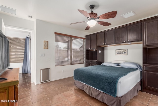 bedroom featuring light tile patterned floors and baseboards