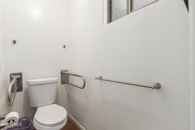 half bath featuring toilet