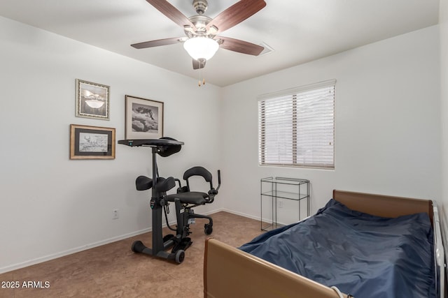 bedroom with baseboards, carpet, and a ceiling fan