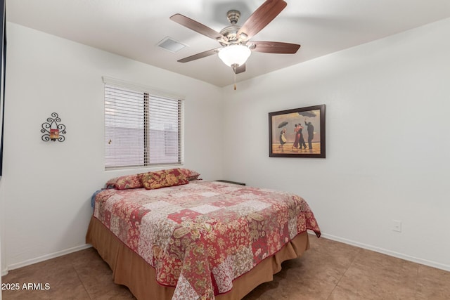bedroom with baseboards, light tile patterned floors, and ceiling fan
