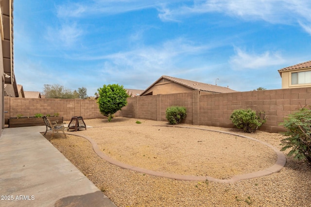fenced backyard featuring a patio