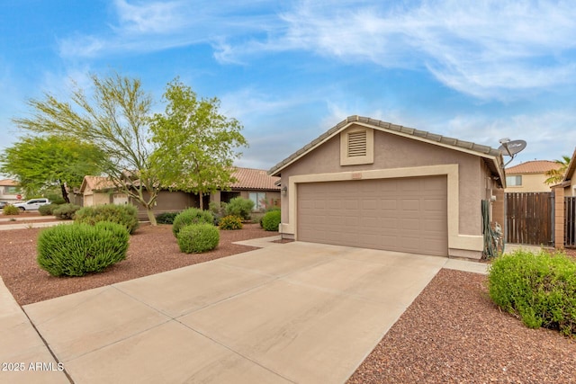 ranch-style house with stucco siding, concrete driveway, fence, a garage, and a tiled roof