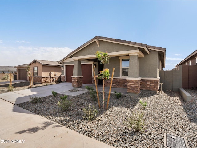 craftsman inspired home with a garage