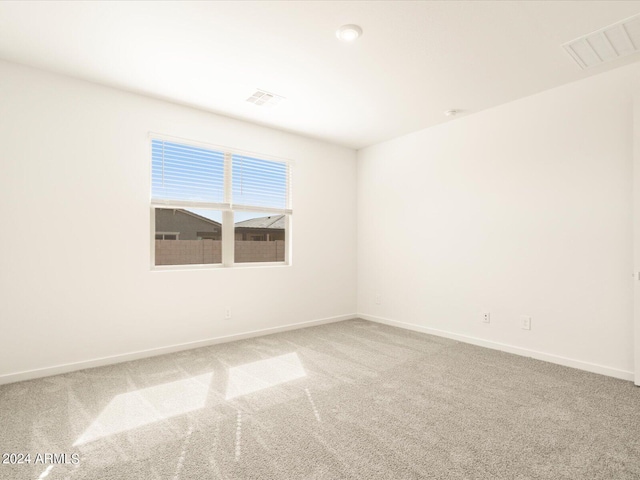 unfurnished room featuring carpet floors