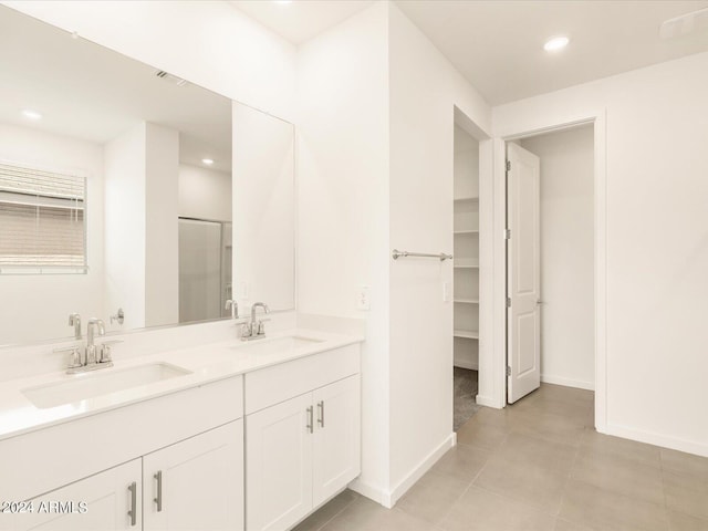 bathroom with vanity and tile patterned flooring