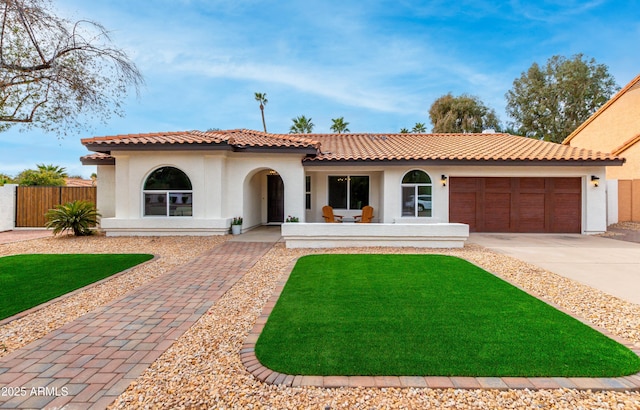 mediterranean / spanish-style house featuring a garage