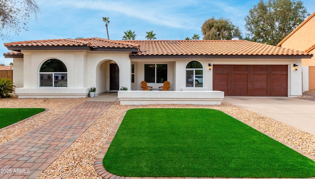 mediterranean / spanish-style house featuring a garage