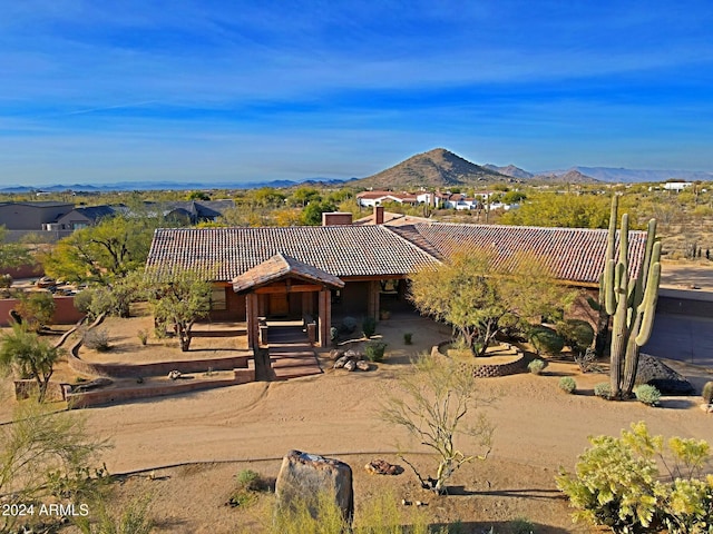 view of front of home featuring a mountain view