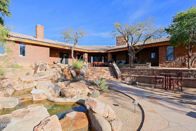 back of property featuring a patio area