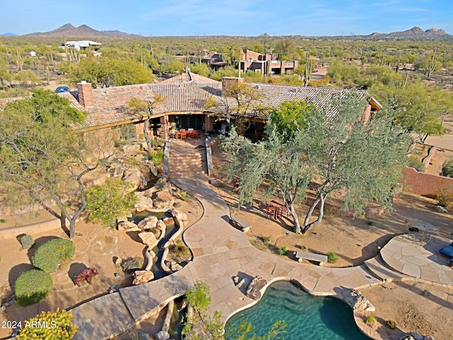 birds eye view of property featuring a mountain view