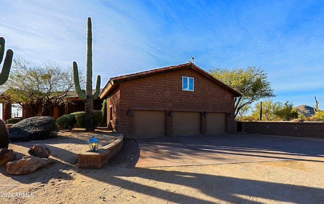 view of side of property with a garage