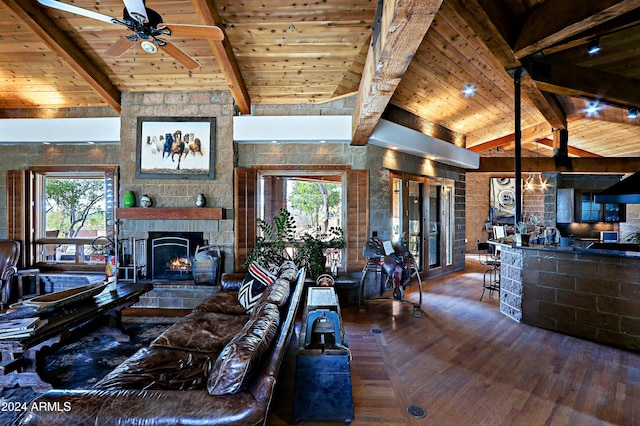 living room featuring hardwood / wood-style floors, wood ceiling, high vaulted ceiling, ceiling fan, and beam ceiling