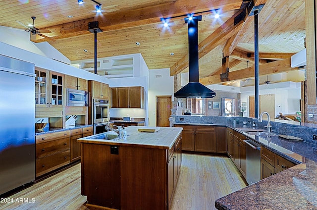 kitchen featuring a large island with sink, wood ceiling, built in appliances, sink, and beam ceiling