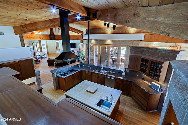 kitchen with wood ceiling, stainless steel dishwasher, light hardwood / wood-style flooring, and beamed ceiling