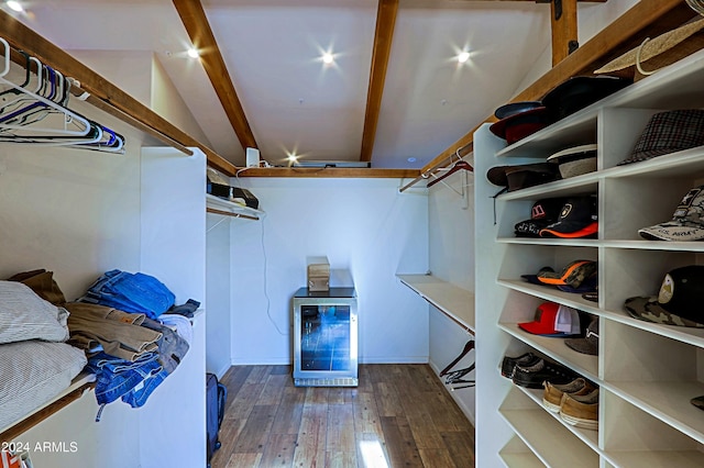 walk in closet with beverage cooler and hardwood / wood-style flooring