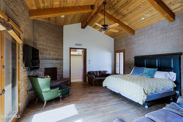 bedroom featuring wood ceiling, hardwood / wood-style floors, a fireplace, high vaulted ceiling, and beam ceiling