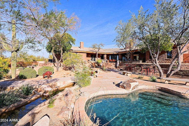 view of pool featuring a patio