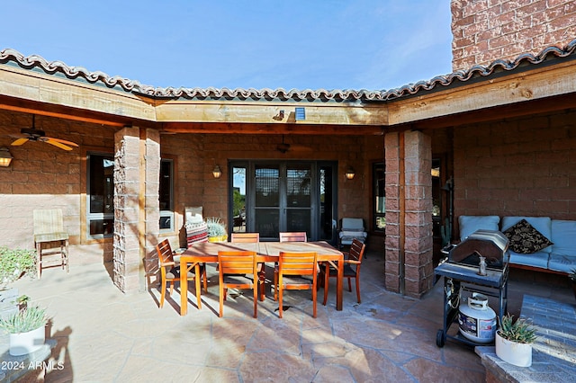 view of patio / terrace featuring ceiling fan