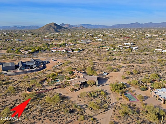 birds eye view of property featuring a mountain view