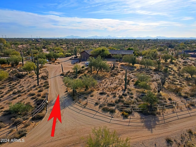 birds eye view of property with a mountain view