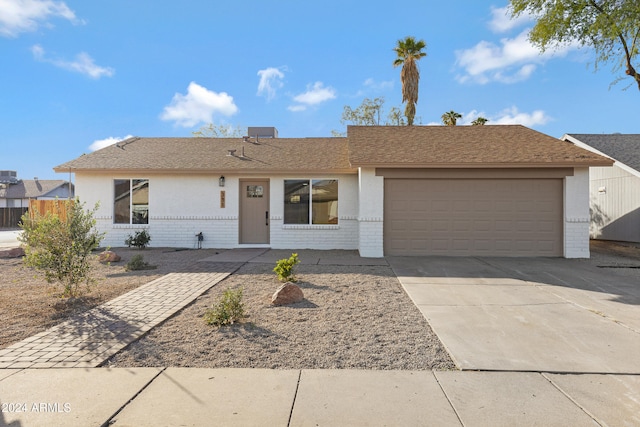 ranch-style home featuring a garage