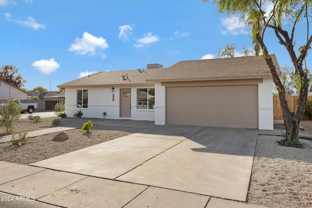 single story home featuring a garage