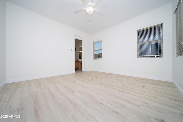 unfurnished room featuring ceiling fan and light wood-type flooring