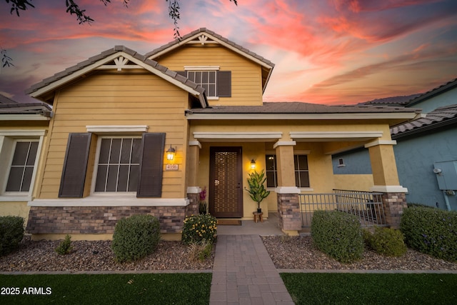 craftsman-style home featuring covered porch