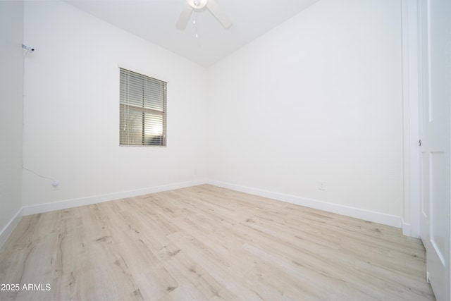 spare room featuring light hardwood / wood-style floors and ceiling fan