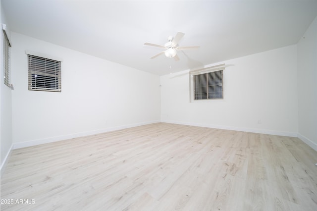 unfurnished room featuring ceiling fan and light wood-type flooring