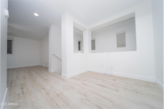 unfurnished room with light wood-type flooring