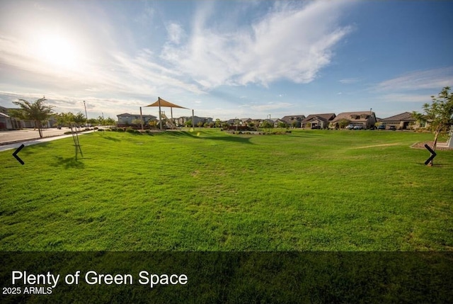 view of home's community featuring a yard