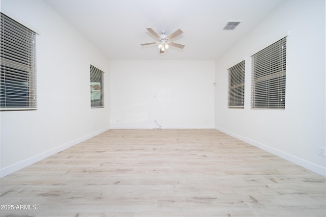 unfurnished room with ceiling fan and light hardwood / wood-style floors