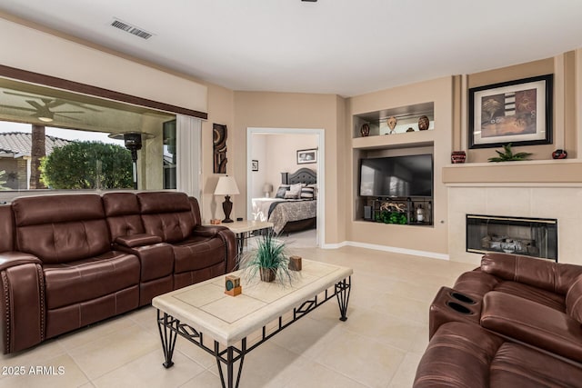 tiled living room with a fireplace and built in features