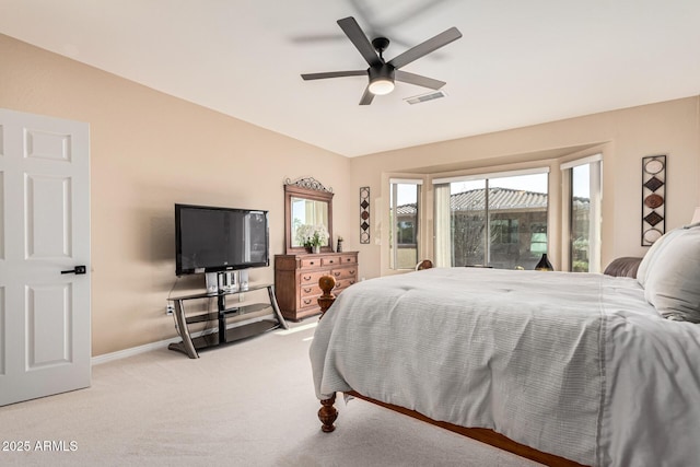 carpeted bedroom featuring lofted ceiling and ceiling fan