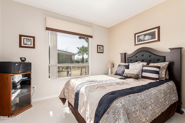 bedroom featuring light colored carpet