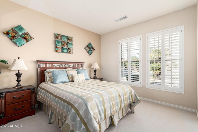 bedroom featuring light colored carpet