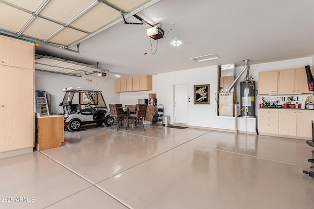 garage featuring water heater and a garage door opener