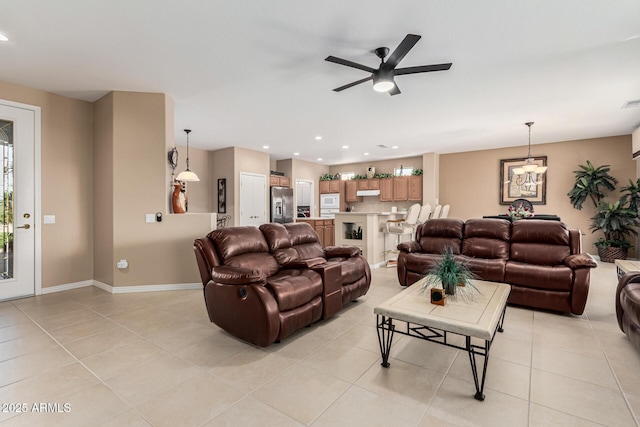 living room with light tile patterned flooring and ceiling fan